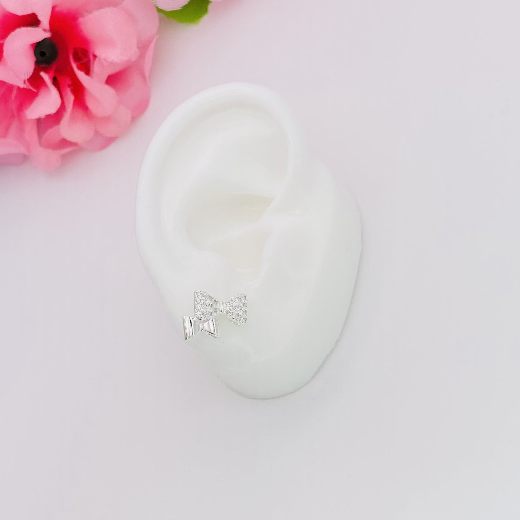 Brinco dois laços cravejado ref 3097