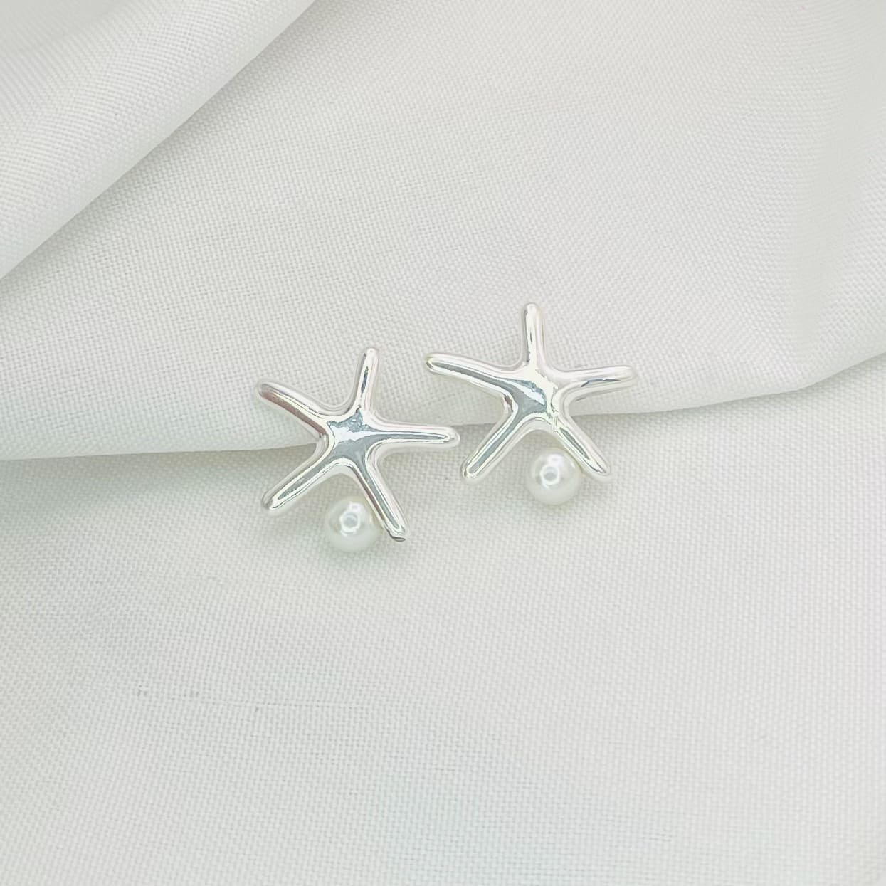 Brinco estrela pérola ref 3929