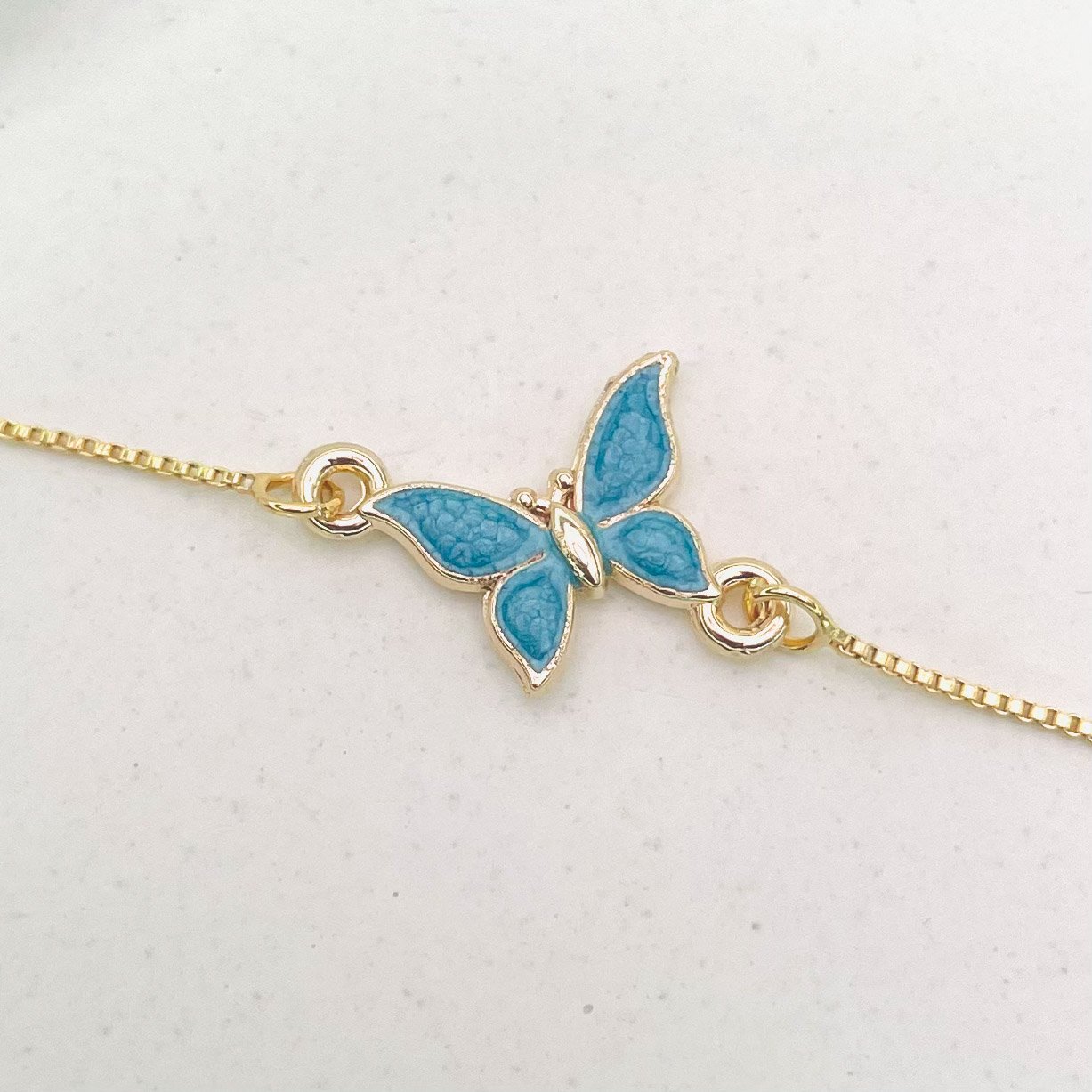 Pulseira borboleta azul dourado REF 4089